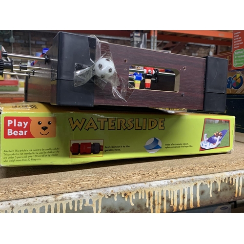 1120 - A PLAY BEAR WATERSLIDE, AS NEW IN BOX AND A SMALL TABLE FOOTBALL GAME