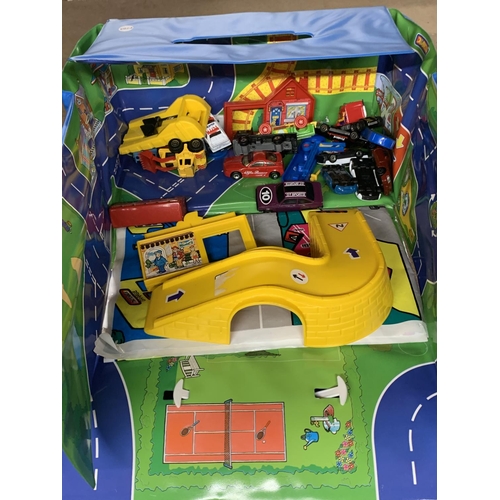 1122 - A FOLD UP CAR PLAYMAT WITH A QUANTITY OF CARS