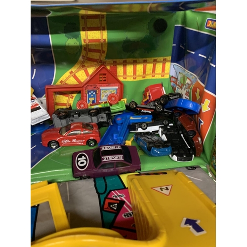 1122 - A FOLD UP CAR PLAYMAT WITH A QUANTITY OF CARS