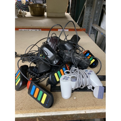 1156 - A QUANTITY OF PLAYSTATION CONTROLLERS