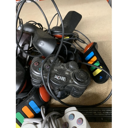 1156 - A QUANTITY OF PLAYSTATION CONTROLLERS