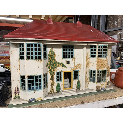 1169 - A VINTAGE METAL DOLL'S HOUSE WITH FURNITURE