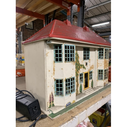 1169 - A VINTAGE METAL DOLL'S HOUSE WITH FURNITURE