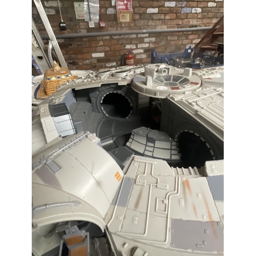 494 - A LARGE STAR WARS MODEL OF A MILLENIUM FALCON - SOME PARTS MISSING, PLUS TWO WOODEN FIGURES