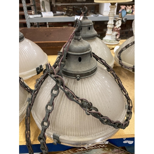 1321 - A SET OF FOUR HOLOPHANE LAMPS WITH METAL FITTINGS AND CHAIN