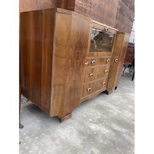 2505 - A WALNUT ART DECO COCKTAIL SIDEBOARD WITH MIRRORED DROP-DOWN FRONT, TWO CUPBOARDS AND THREE DRAWERS,... 