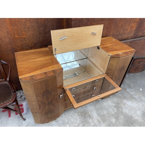 2505 - A WALNUT ART DECO COCKTAIL SIDEBOARD WITH MIRRORED DROP-DOWN FRONT, TWO CUPBOARDS AND THREE DRAWERS,... 