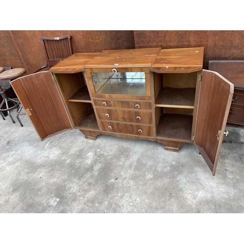 2505 - A WALNUT ART DECO COCKTAIL SIDEBOARD WITH MIRRORED DROP-DOWN FRONT, TWO CUPBOARDS AND THREE DRAWERS,... 