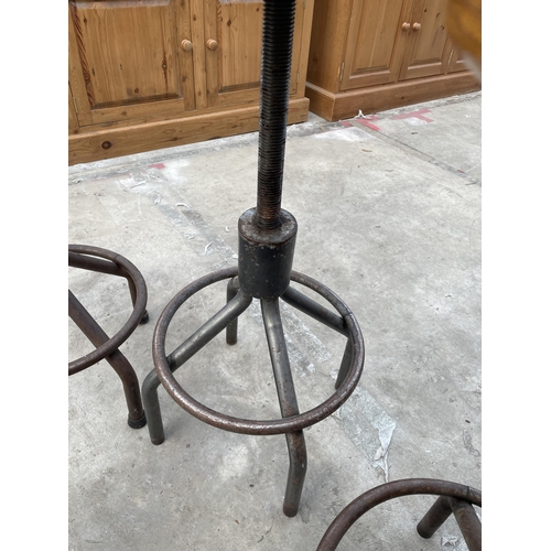 2509 - THREE INDUSTRIAL STOOLS ON TUBULAR METAL BASE