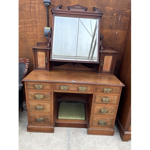 2511 - A VICTORIAN WALNUT KNEEHOLE DRESSING TABLE ENCLOSING NINE DRAWERS, TWO GLAZED CUPBOARDS AND FOOTREST... 