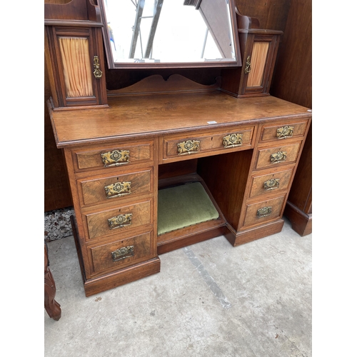 2511 - A VICTORIAN WALNUT KNEEHOLE DRESSING TABLE ENCLOSING NINE DRAWERS, TWO GLAZED CUPBOARDS AND FOOTREST... 