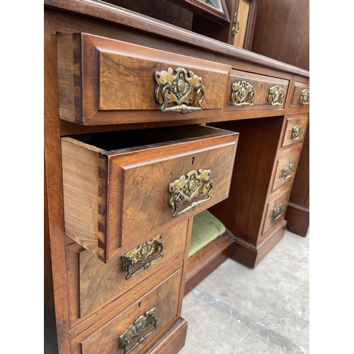 2511 - A VICTORIAN WALNUT KNEEHOLE DRESSING TABLE ENCLOSING NINE DRAWERS, TWO GLAZED CUPBOARDS AND FOOTREST... 