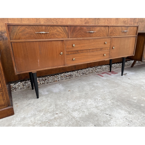 2514 - A RETRO TEAK SIDEBOARD ON BLACK TAPERING LEGS ENCLOSING FIVE DRAWERS AND TWO CUPBOARDS, 72