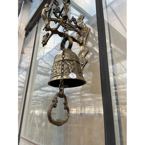 1523 - A DECORATIVE BRASS WALL HANGING BELL