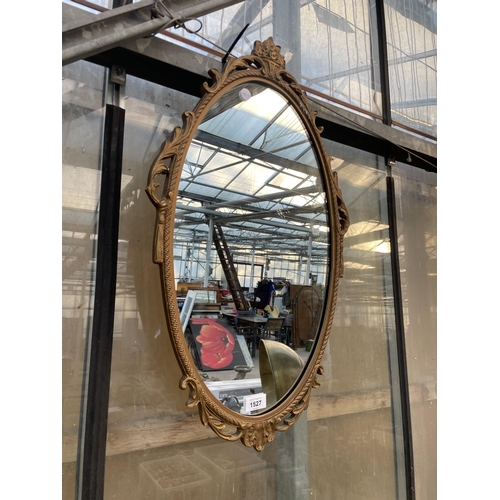 1527 - A DECORATIVE WALL MIRROR WITH MOULDED FRAME