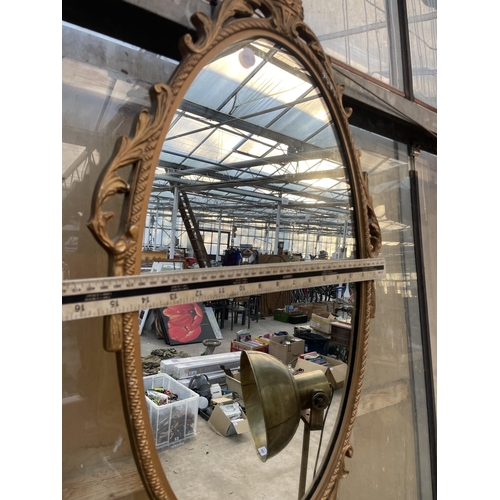 1527 - A DECORATIVE WALL MIRROR WITH MOULDED FRAME