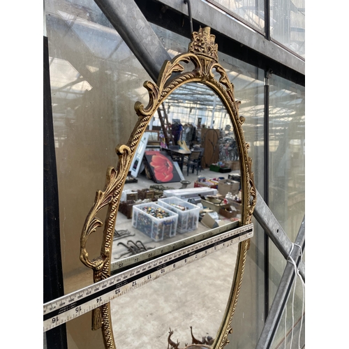 1529 - A DECORATIVE BRASS FRAMED WALL MIRROR