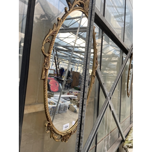 1529 - A DECORATIVE BRASS FRAMED WALL MIRROR