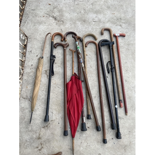 1535 - AN ASSORTMENT OF WALKING STICKS AND UMBRELLAS