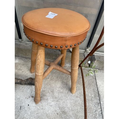 1538 - A FOUR LEGGED PINE STOOL WITH LEATHER SEAT