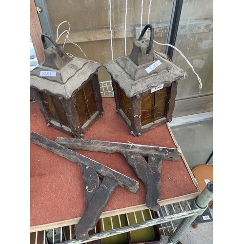 1540 - A PAIR OF OAK LANTERNS WITH YELLOW GLASS AND WALL HANGING BRACKETS