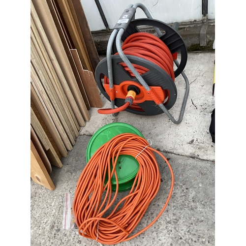 1693 - A GARDEN HOSE REEL AND TWO EXTENSION LEADS