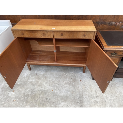 2516 - A GORDON RUSSELL ELLIPSES RETRO TEAK SIDEBOARD ENCLOSING TWO DRAWERS AND TWO CUPBOARDS WITH CIRCULAR... 