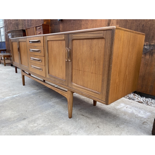 2520 - A G-PLAN RETRO TEAK SIDEBOARD ENCLOSING FOUR DRAWERS AND FOUR CUPBOARDS ON OPEN BASE, 84