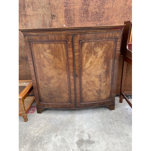 2532 - A 19TH CENTURY MAHOGANY BOWFRONTED TWO DOOR CUPBOARD ON BRACKET FEET, 45.5