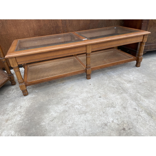 2533 - A TWO TIER COFFEE TABLE WITH INSET GLASS TOP AND CANE LOWER SHELF, 50 X 21