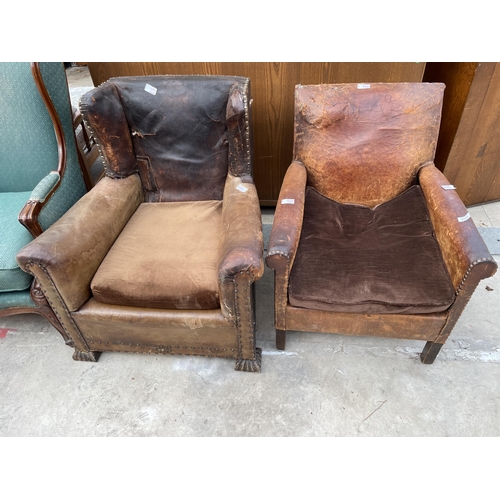 2534 - AN EARLY 20TH CENTURY LEATHER STUDDED WINGED FIRESIDE CHAIR AND SIMILAR CHAIR