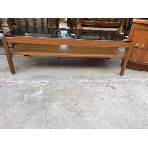 2538 - A RETRO TEAK TWO TIER COFFEE TABLE WITH SMOKED GLASS TOP, 44 X 19