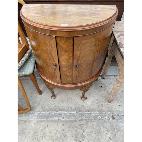 2540 - A MID 20TH CENTURY WALNUT BOWFRONTED TWO DOOR CABINET ON CABRIOLE LEGS, 31