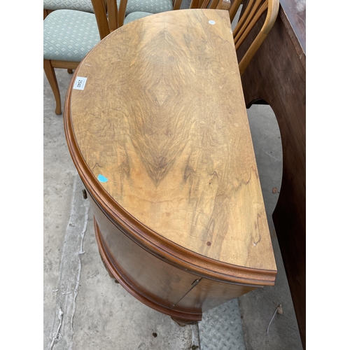 2540 - A MID 20TH CENTURY WALNUT BOWFRONTED TWO DOOR CABINET ON CABRIOLE LEGS, 31