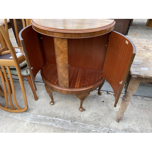 2540 - A MID 20TH CENTURY WALNUT BOWFRONTED TWO DOOR CABINET ON CABRIOLE LEGS, 31