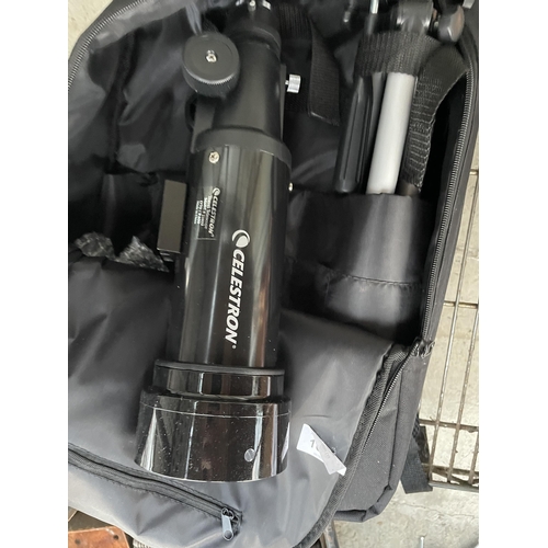 A CELESTRON TRAVEL TELESCOPE WITH CARRY BAG AND MANUAL
