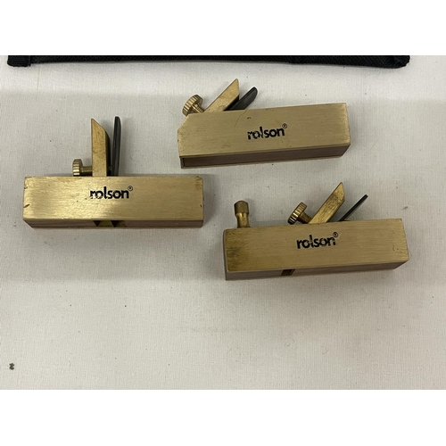23 - A ROLSON THREE PIECE MINI BRASS PLANE KIT TO INCLUDE A PIANO PLANE, SCRAPPER AND BULL NOSE WITH A ST... 