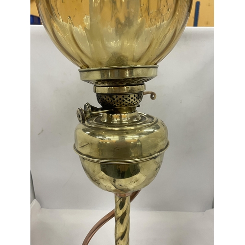 27 - A VINTAGE OIL LAMP WITH MABER COLOURED GLASS SHADE, GLASS FUNNEL AND A BRASS AND COPPER TWISTED BASE
