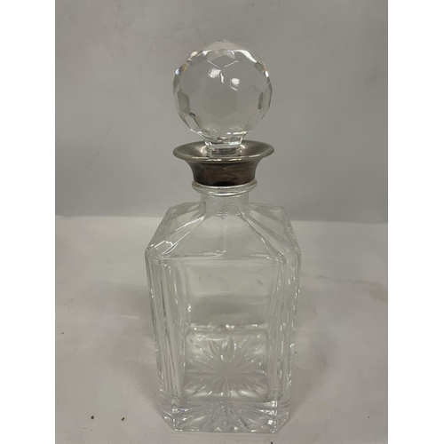 28 - A CUT GLASS DECANTER (STOPPER A/F) WITH A TESTED TO SILVER COLLAR