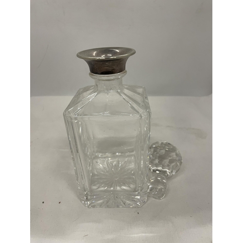28 - A CUT GLASS DECANTER (STOPPER A/F) WITH A TESTED TO SILVER COLLAR