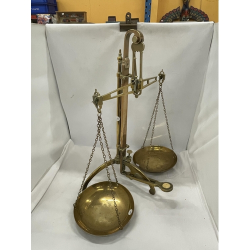 32 - A PAIR OF VINTAGE BRASS BALANCE SCALES