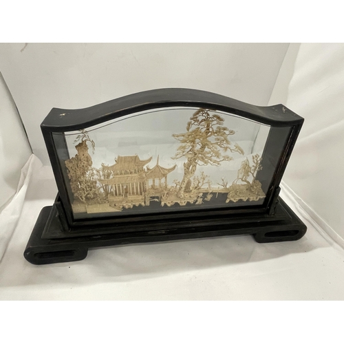 35 - A VINTAGE CARVED ORIENTAL CORK DIORAMA IN A  PRESENTATION FRAME