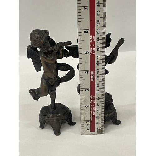 4 - A PAIR OF BRONZE CHERUBS ONE PLAYING A LUTE AND ONE A FLUTE APPROXIMATELY 6 INCHES TALL