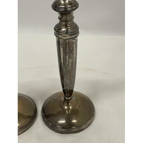 49 - A PAIR OF HALLMARKED BIRMINGHAM SILVER CANDLESTICKS (ONE A/F) WITH WEIGHTED BASES