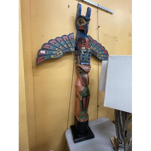 69 - A LARGE WOODEN TOTEM POLE FIGURE