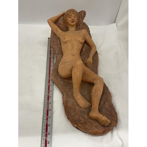 9 - A STUDIO POTTERY SCULPTURE OF A NAKED LADY