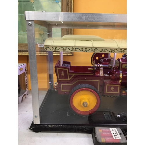 305 - A VINTAGE WOODEN MODEL STEAM ENGINE, ON A WOODEN PLINTH BASE WITH PERSPEX DISPLAY BOX AND WITH BATTE... 