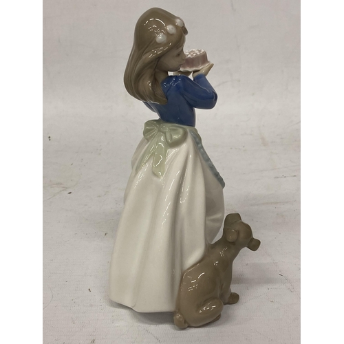 987A - A NAO FIGURINE OF A GIRL WITH A BIRTHDAY CAKE AND PUPPY