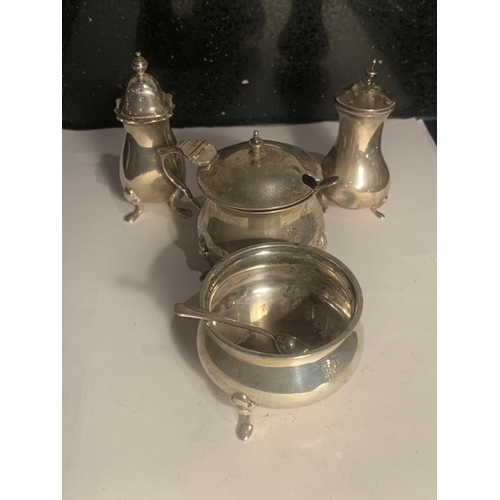 64 - A HALLMARKED BIRMINGHAM SILVER CRUET SET WITH TWO SPOONS GROSS WEIGHT 133.7 GRAMS