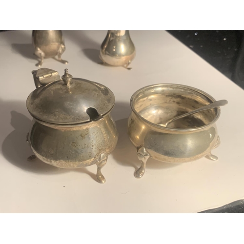 64 - A HALLMARKED BIRMINGHAM SILVER CRUET SET WITH TWO SPOONS GROSS WEIGHT 133.7 GRAMS